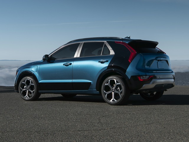 rear left hand side view of a blue 2024 kia niro phev parked