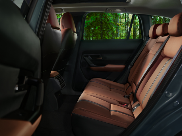 right hand side car door open, view of leather interior backseats on the 2024 mazda cx-50